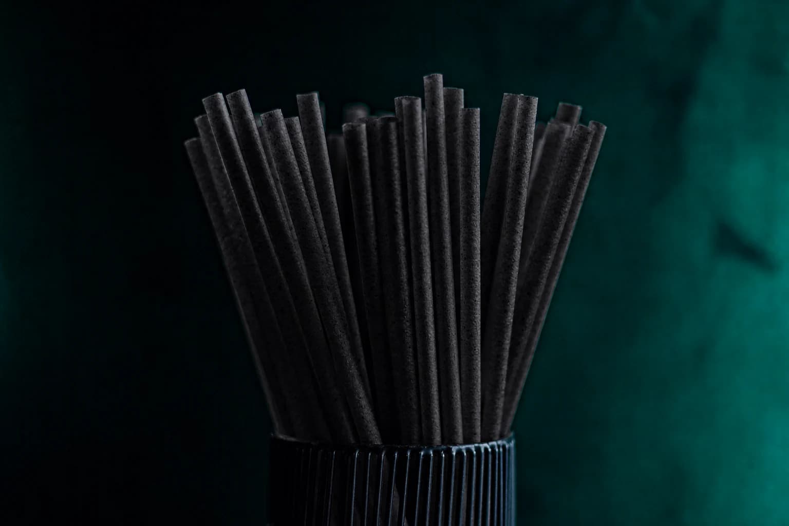 Black 6 mm sugarcane straws arranged for regular drink service